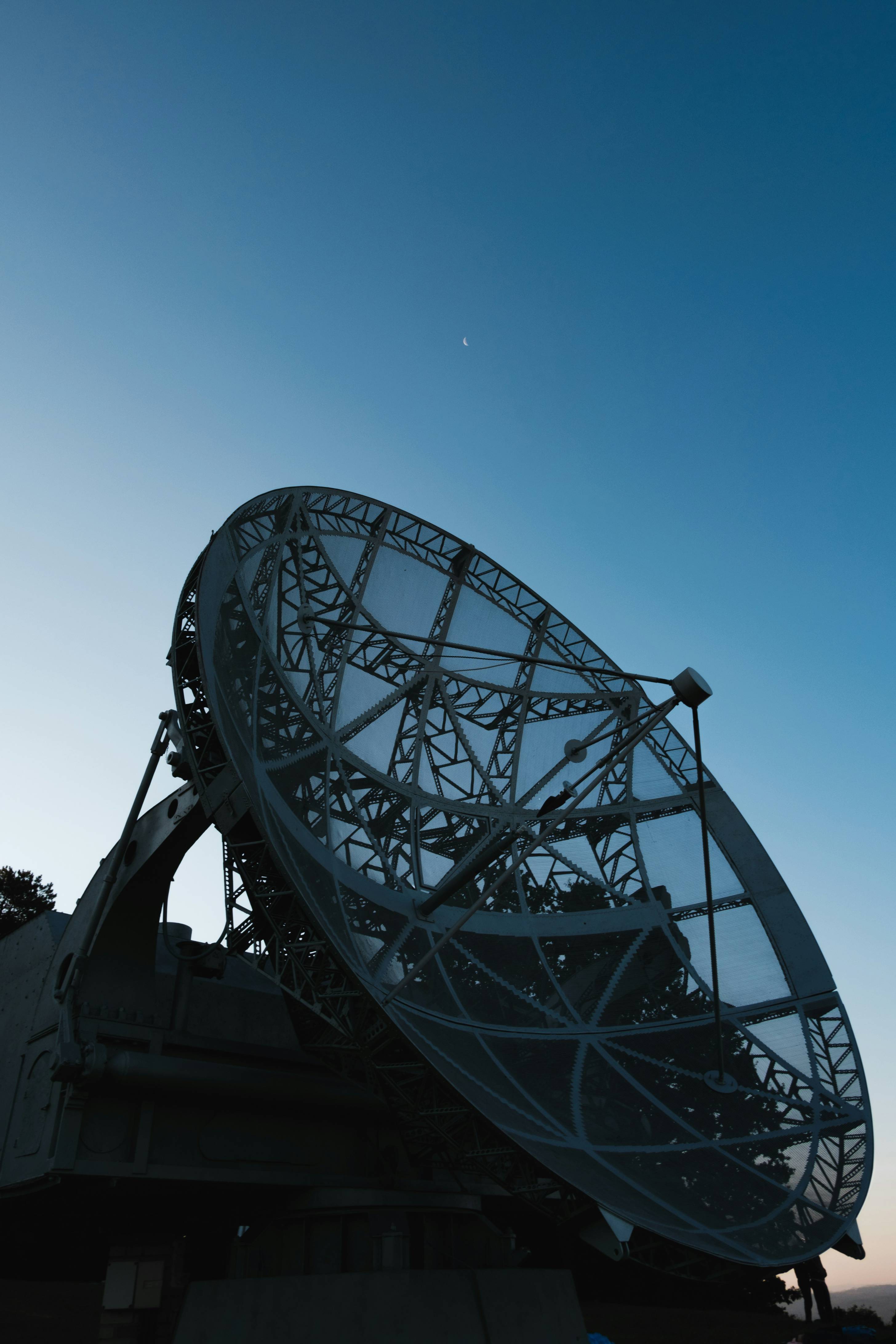 a large satellite dish sitting on top of a building